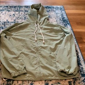 Green windbreaker with hood